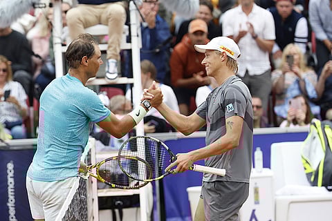 Rafael Nadal greets Leo Borg after winning men's singles